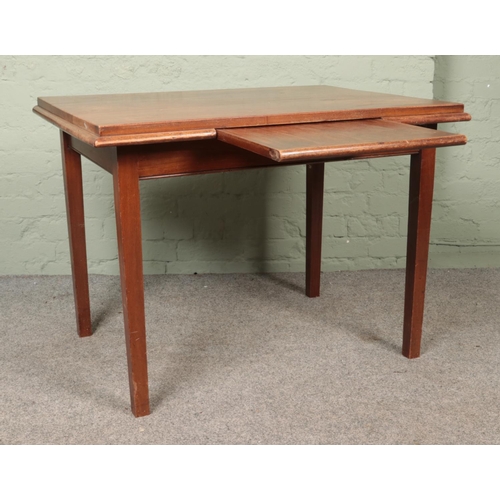 600 - A mahogany table with central slide and square tapering legs