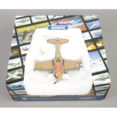 26 - A Franklin Mint Precision Model aircraft from the Armour Collection; Curtiss P-40N Warhawk 'Parrothe... 