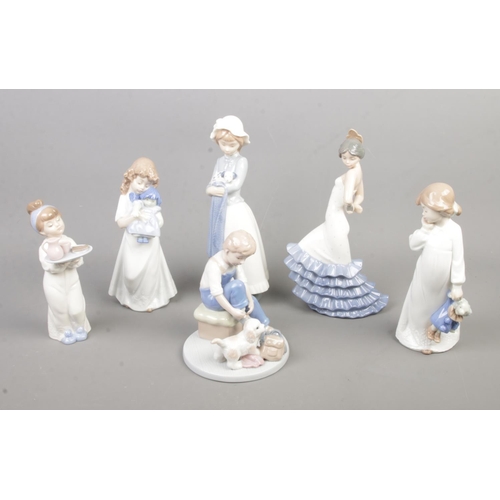 31 - A collection of six Nao by Lladro figurines including Girl Holding Puppy With Blanket and Flamenco D... 