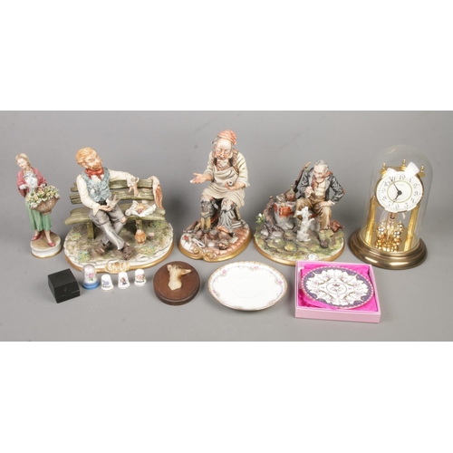 48 - A collection of Capodimonte ceramic figures to along with assorted collectables to include Robert Be... 