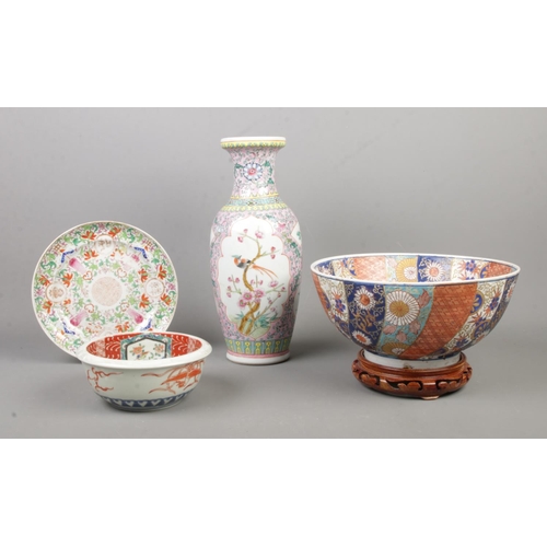 54 - A quantity of oriental ceramics, to include Chinese famille rose vase, Koi bowl on wooden stand and ... 