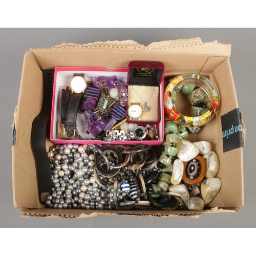 59 - A tray of assorted costume jewellery, to include decorative belt buckle, opal necklace, bangles and ... 