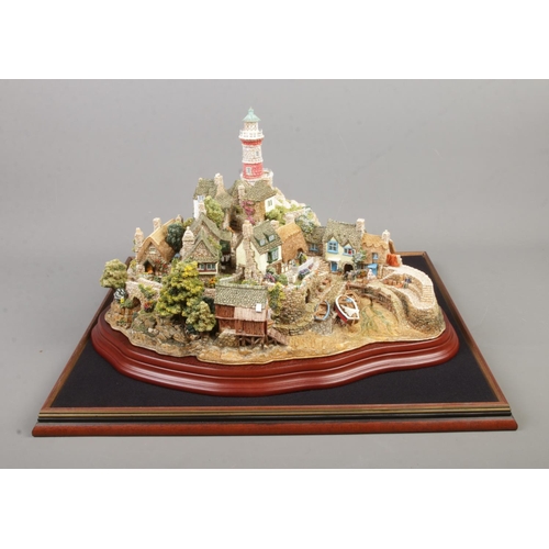 64 - A limited edition Lilliput Lane model 'Out Of The Storm', 2382/3000. Comes with original box and pap... 