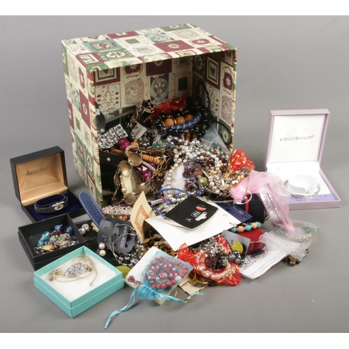 67 - A box of costume jewellery. Includes brooches, beads, earrings, rings, etc.