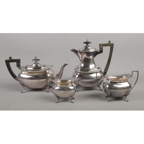 70 - A Walker and Hall four piece silver plated tea sevice; contains teapot, coffee pot, milk jug and sug... 