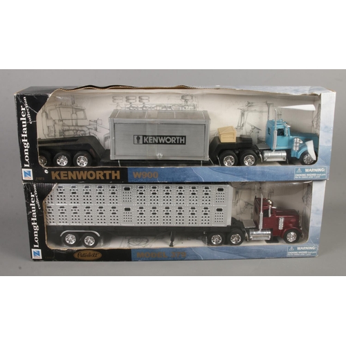 79 - Two boxed NewRay Long Hauler Collection models. Includes Kenworth W900 and Peterbilt Model 379.