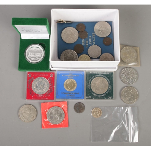 82 - A box of coins. Includes silver George III 1816 shilling, commemorative crowns, etc.