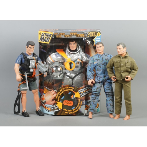 94 - A boxed Hasbro Action Man 'Mission 2000' figure, together with three other action figures.