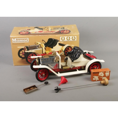 97 - A boxed Mamod Live Steam Roadster featuring black leather seats and red spoked wheels.