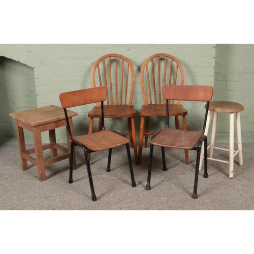 553 - A collection of chairs and stools, to include two vintage Ercol dining chairs, model 290 and a paint... 