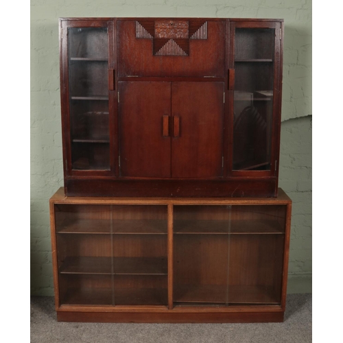 555 - Two pieces of furniture; an oak side by side bureau together with a glass fronted sliding bookcase. ... 