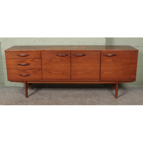 558 - An Avalon teak sideboard. (72cm x 183cm x 43cm)