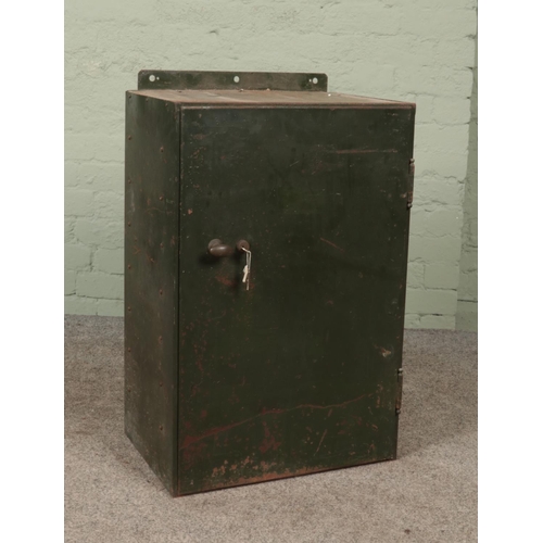 343 - A vintage green painted steel locking cabinet.