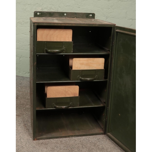 343 - A vintage green painted steel locking cabinet.