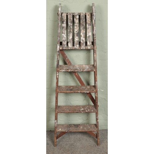 411 - A set of wooden decorators ladders.