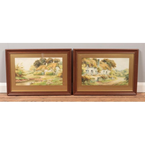 462 - E Hamilton, a pair of framed watercolours, landscape scenes with thatched cottages and figures. 25cm... 