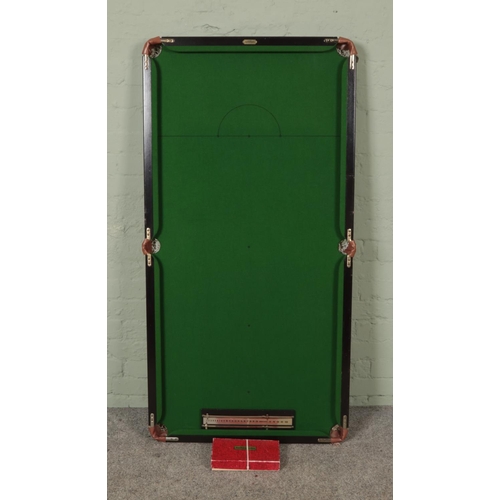 344 - An Ambassador table top snooker table with score board and balls. 79x154cm.