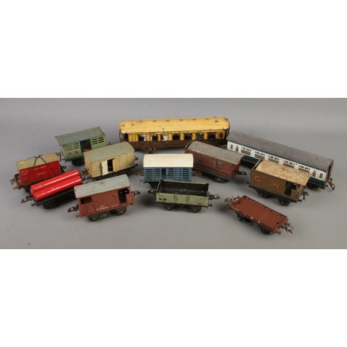 74 - A good quantity of Hornby Meccano O gauge tin plate model railway wagons and carriages.