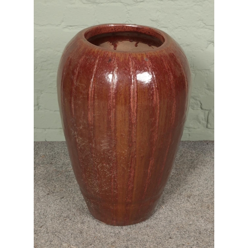 369 - A stoneware salt glaze floor vase. Hx62cm.