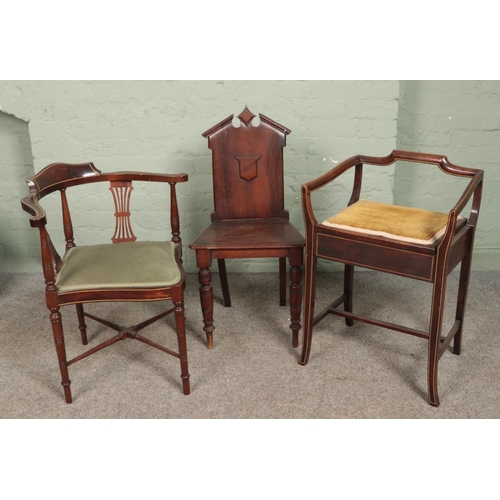 572 - Three antique mahogany chairs. Includes two Edwardian inlaid examples and a Victorian hall chair.