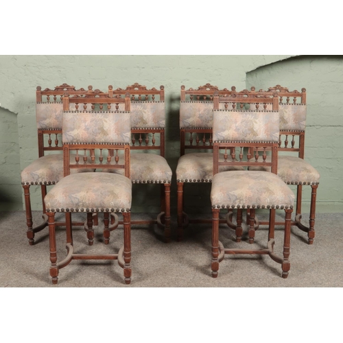 573 - A set of six antique carved mahogany dining chairs with upholstered seats and back rests.