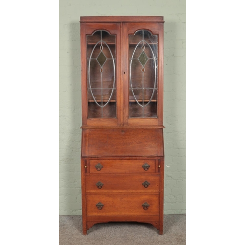 586 - An oak bureau bookcase with leaded and stained glass top. 206 x 80 x 39cm