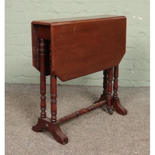 597 - A small Regency style mahogany Sutherland table.