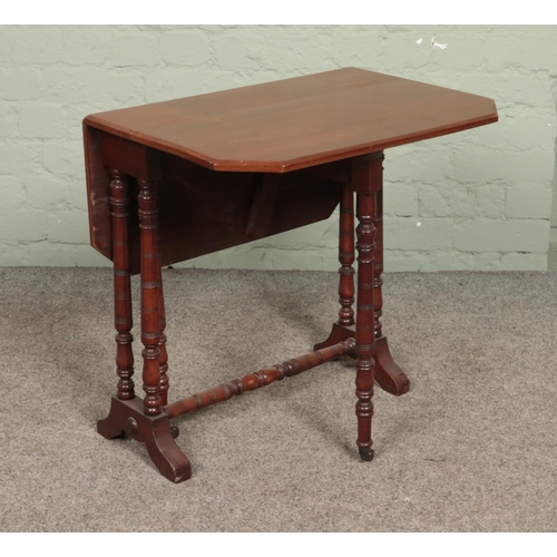 597 - A small Regency style mahogany Sutherland table.