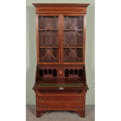 612 - An Edwardian mahogany bureau bookcase. With satinwood inlay and crossbanding. Height 208.5cm, Width ... 