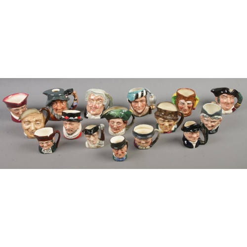 117 - A quantity of Royal Doulton character jugs. Includes Granny, Jester, The Falconer, The Lawyer, etc.