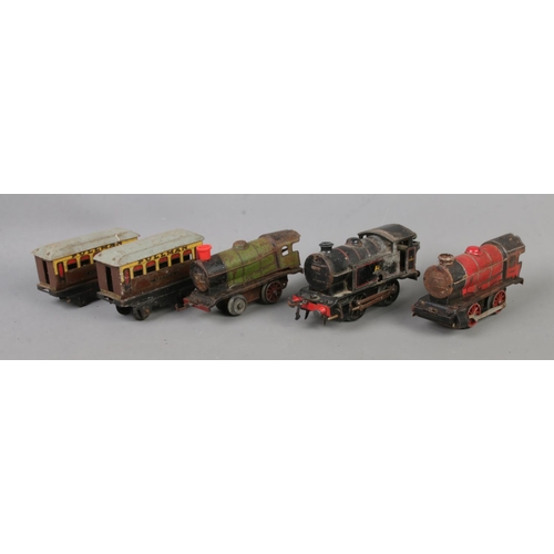 119 - A collection of vintage O Gauge tinplate locomotives to include No. 3 82011.