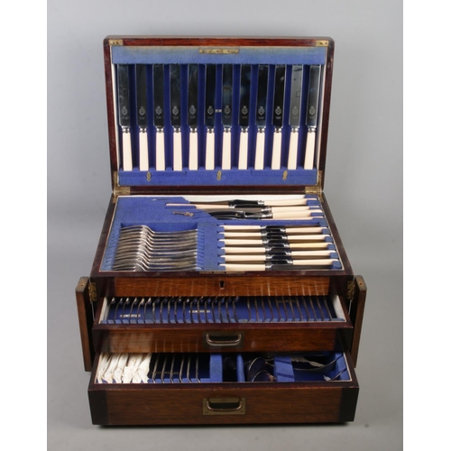 124 - A large Viner and Hall twelve place canteen of cutlery, set within a Wellington style case. With hin... 