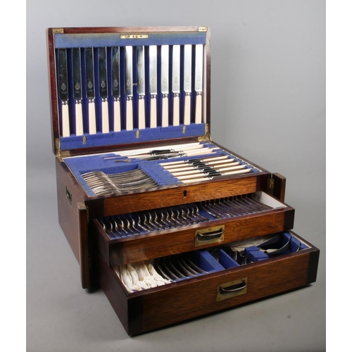 124 - A large Viner and Hall twelve place canteen of cutlery, set within a Wellington style case. With hin... 