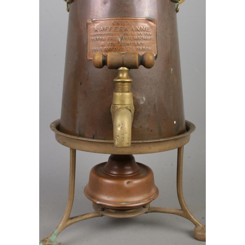 151 - A copper and brass coffee pot, with burner and trivet. Labelled for Ash's Kaffeekanne, manufactured ... 