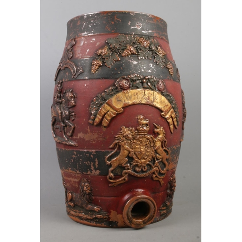 157 - A painted stoneware spirit keg, decorated with grape vine, men on horseback and lions. With partial ... 