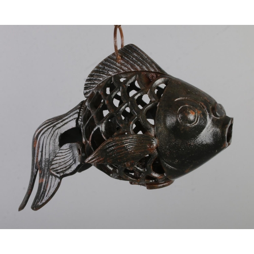 158 - A cast iron hanging candle holder in the form of a fancy goldfish.