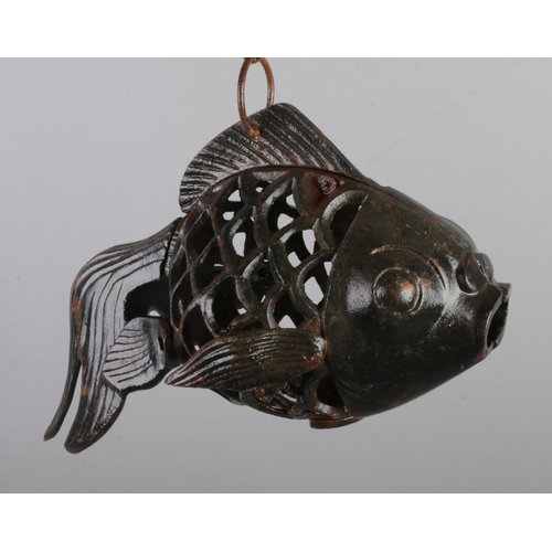 158 - A cast iron hanging candle holder in the form of a fancy goldfish.