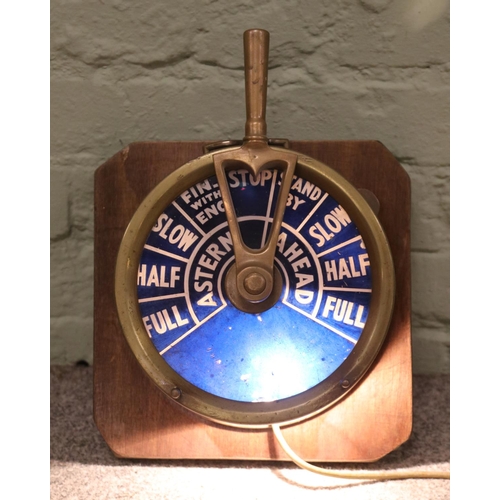 163 - A brass ship's telegraph, mounted on wooden plaque, converted into a lamp.