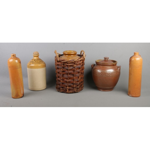 171 - A collection of stoneware, to include a pair of slim bottles labelled for Hilstkamp & Zoon & Molyn, ... 