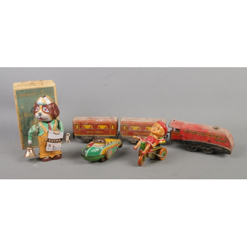 180 - Four vintage tinplate wind up toys to include The National 2509 locomotive with two carriages, boxed... 