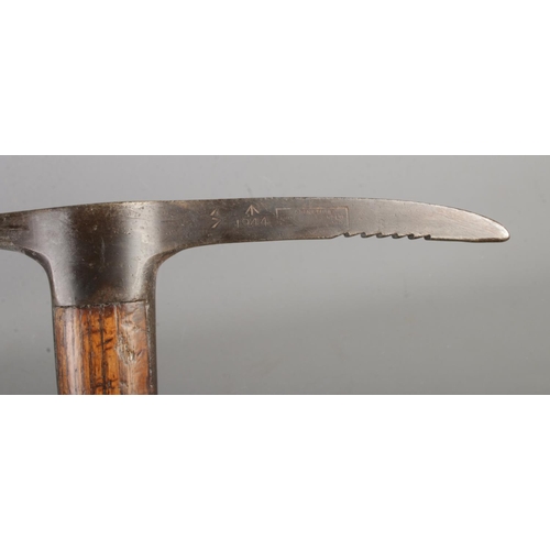 200 - A second world war British military pickaxe with steel head produced by Cornelius Whitehouse LTD sta... 