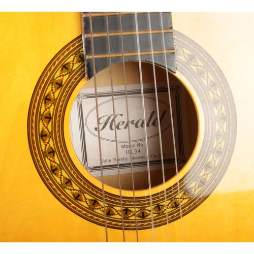 212 - A Herald acoustic guitar, model HL34.