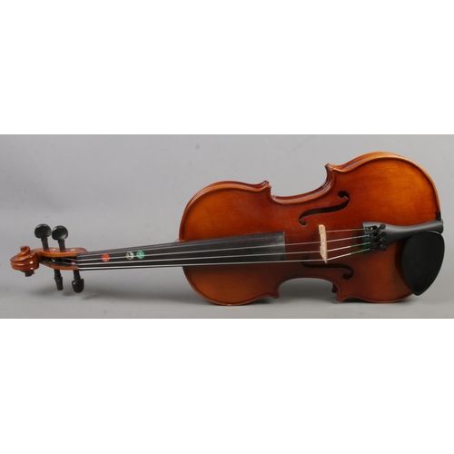 213 - A cased Primavera two piece back 3/4 violin with bow.