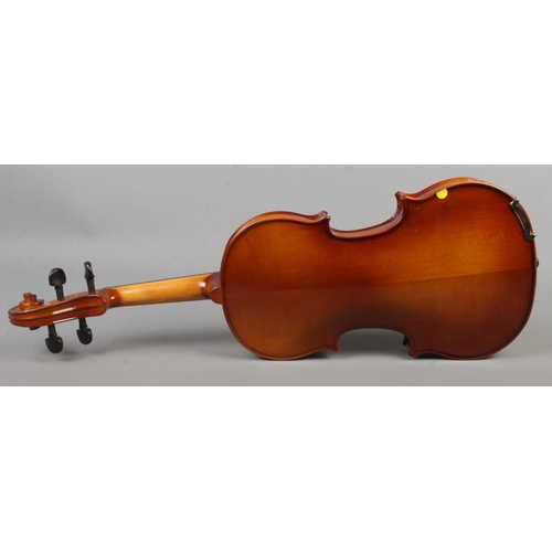 213 - A cased Primavera two piece back 3/4 violin with bow.