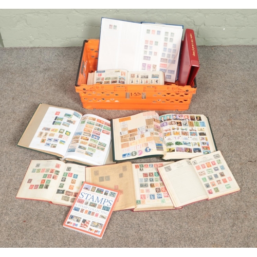 242 - A large collection if stamps from around the world in several albums including the complete guide to... 