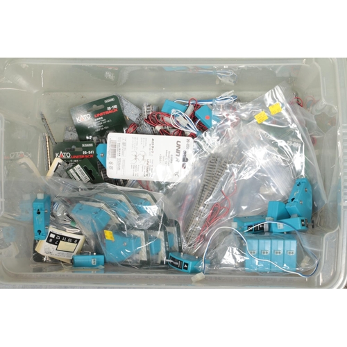 261 - A box of Kato Unitrack for N Gauge model railway. Includes cables, boxed and unboxed track, Power Pa... 