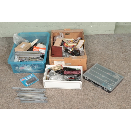 272 - Two boxes of model railway spares and repairs to include motors, cable, track, etc.