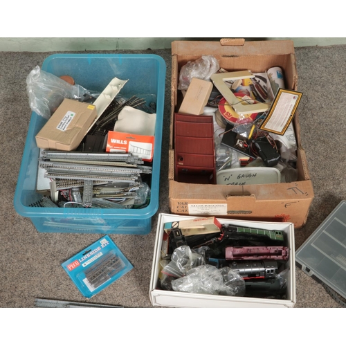 272 - Two boxes of model railway spares and repairs to include motors, cable, track, etc.