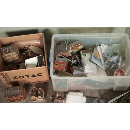 277 - Two boxes of assorted model railway scenery, buildings and diorama supplies. Includes foliage, layou... 