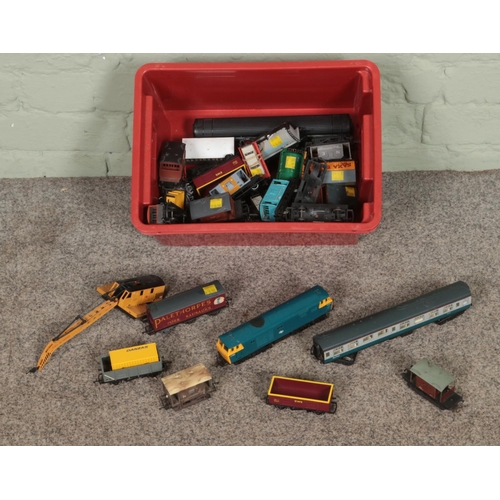 285 - A box of assorted Hornby model railway rolling stock to include crane, wagons, tankers, carriages, e... 